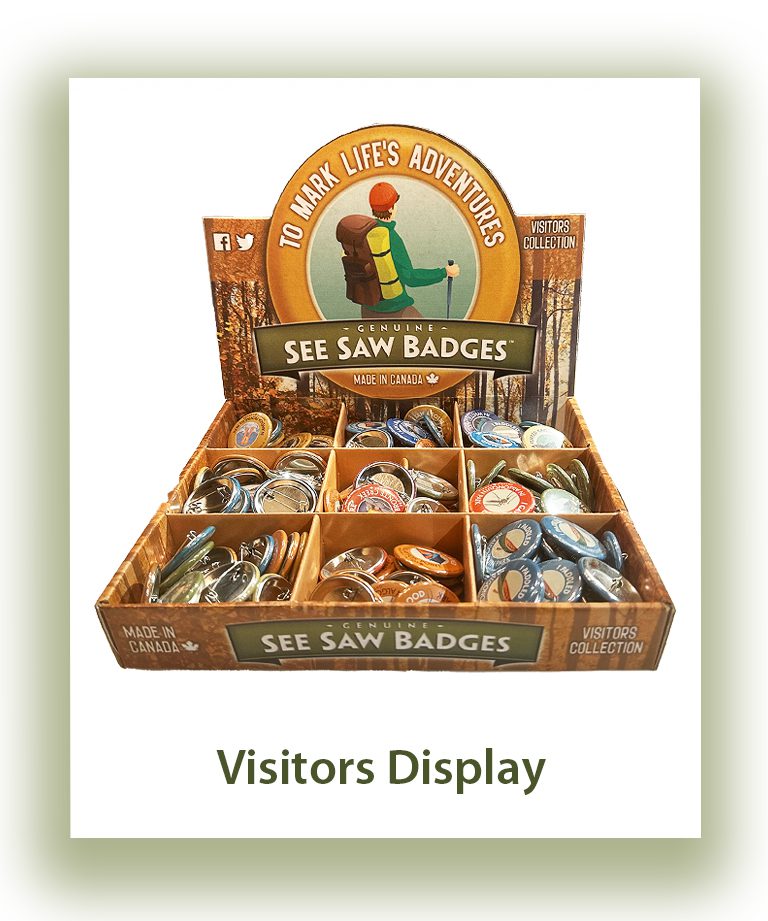 Display box with assorted saw badges for visitors.